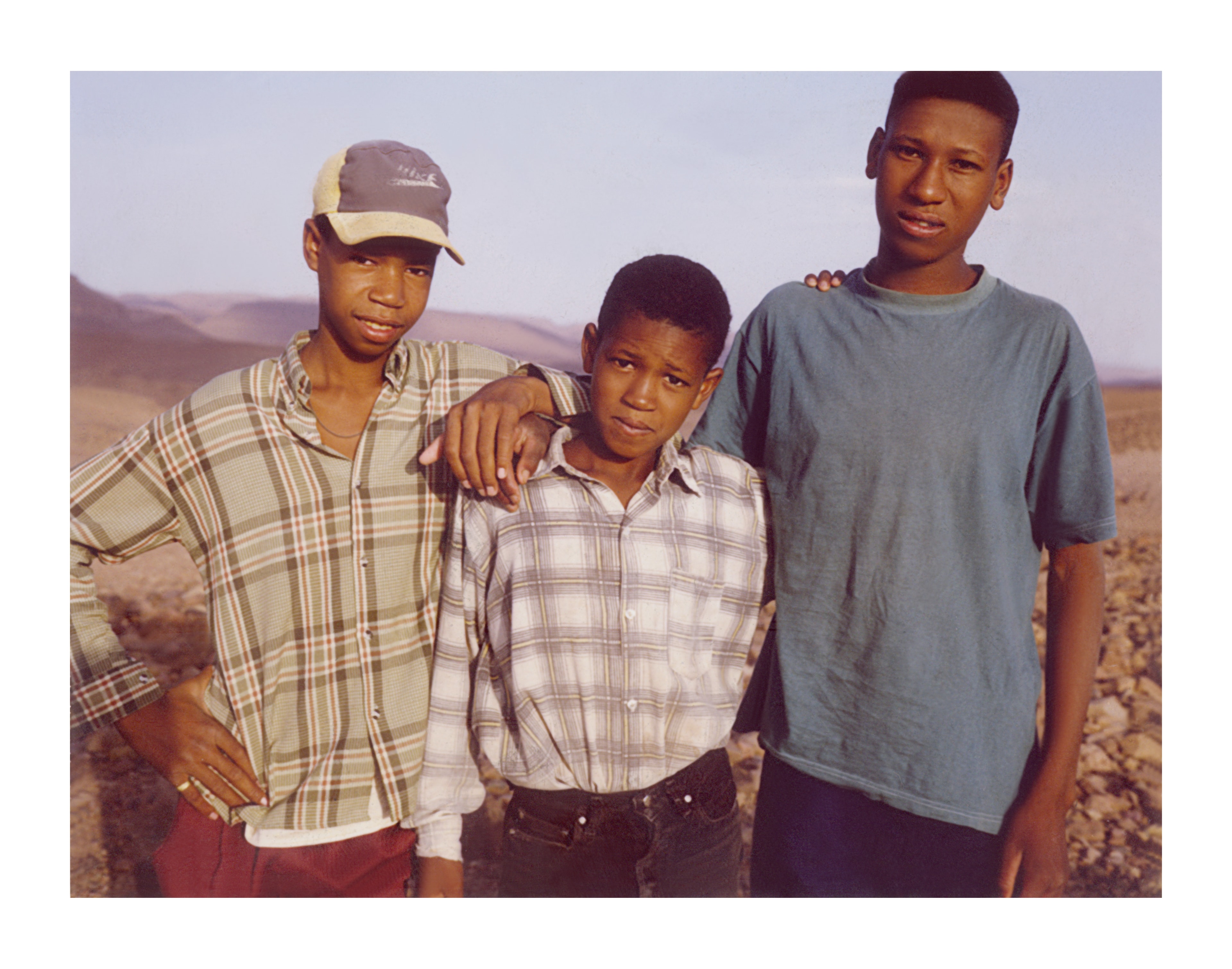 Three young men, Atlas Mountains, Morocco — Polaroid