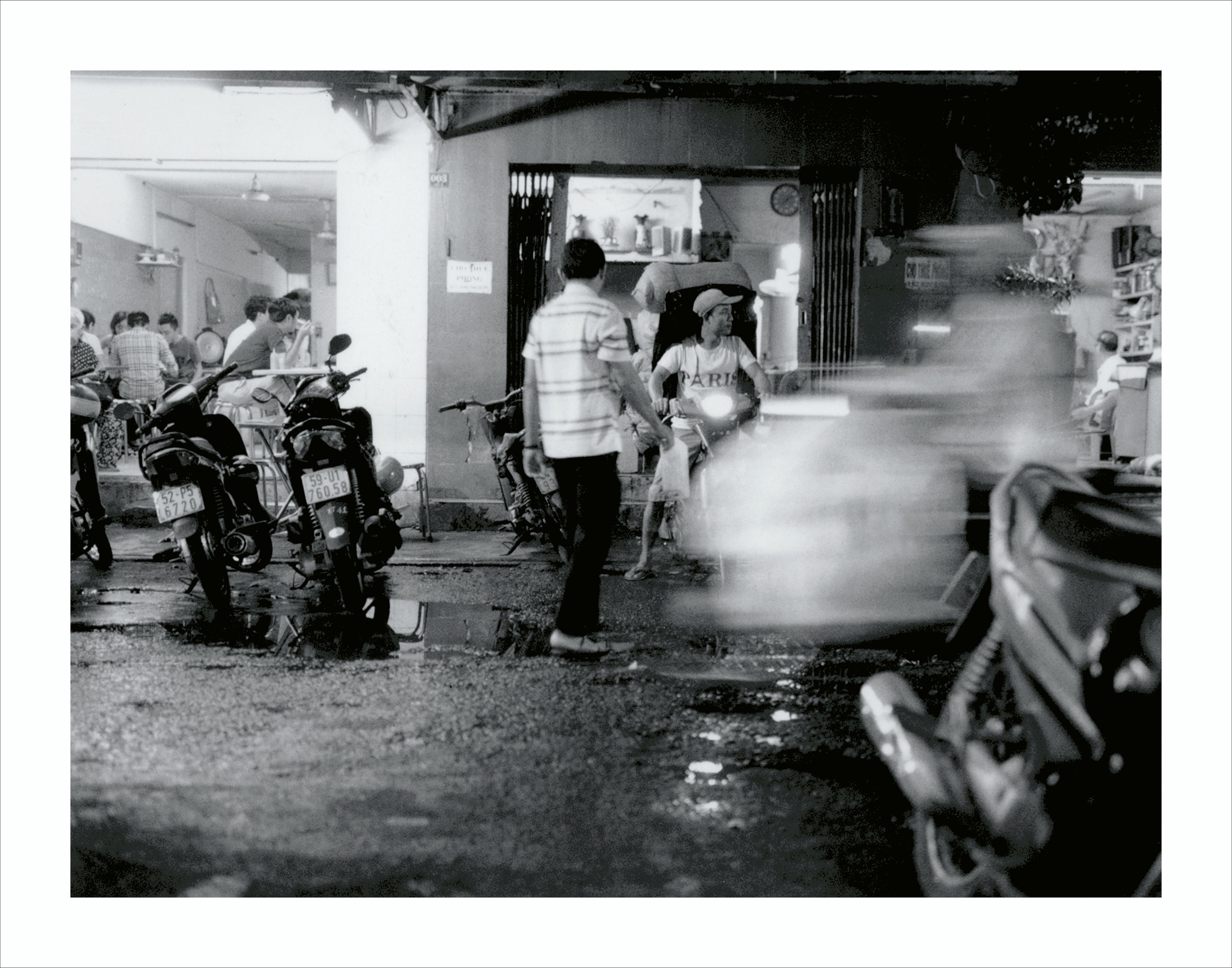 Saigon street at night, motorcycles — Polaroid
